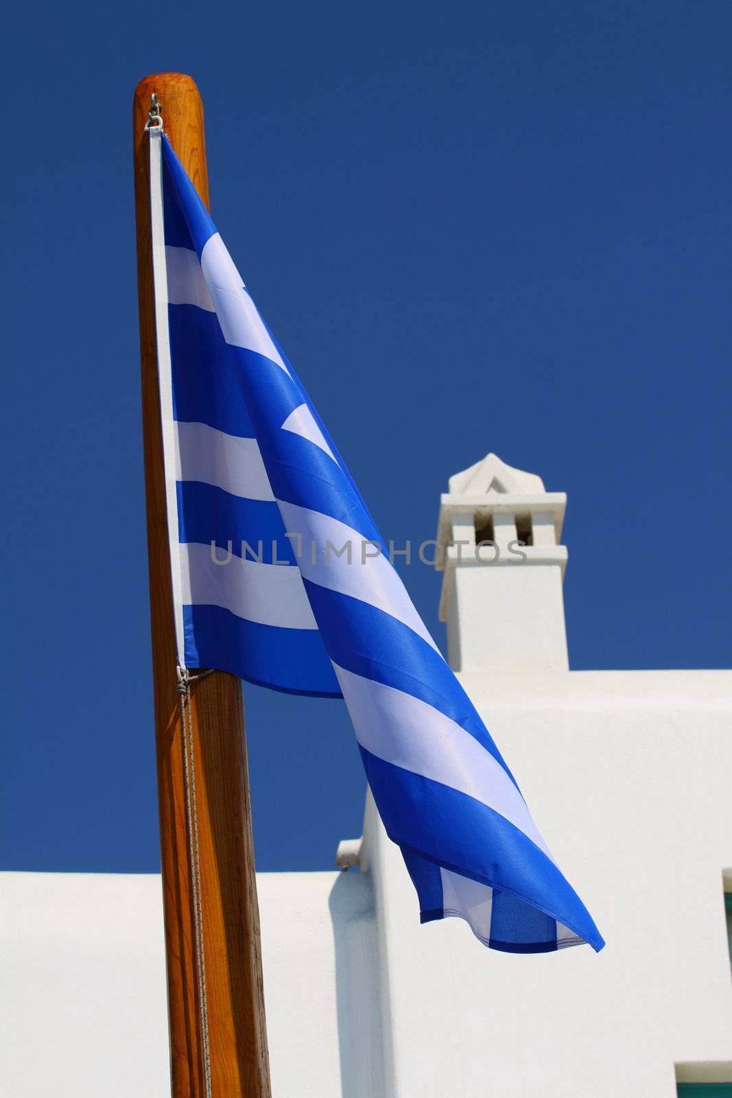 Greek island church with flag and bells greece 