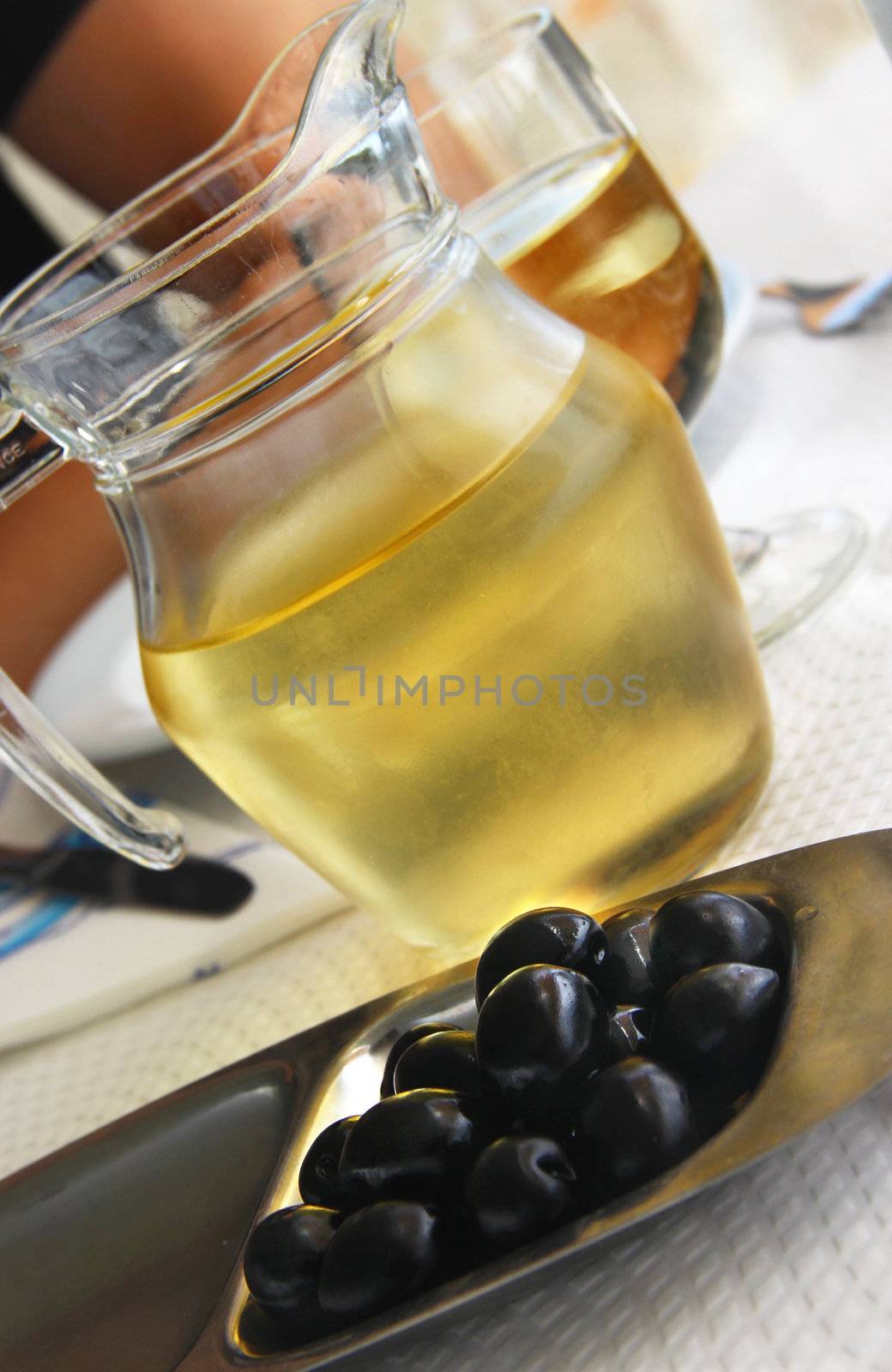 Mediterranean white wine and black olives 