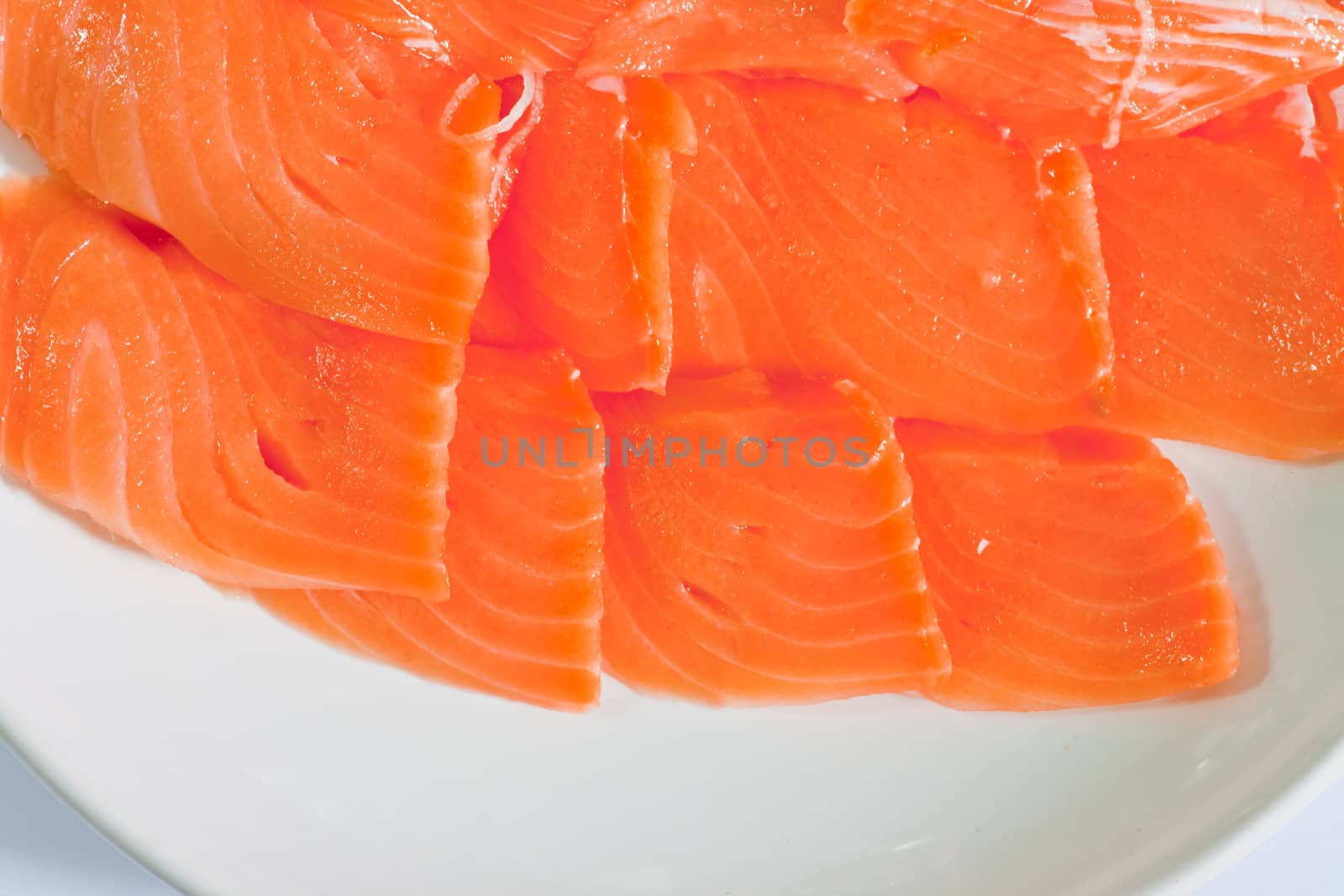 Red fish cut with slices on a dish