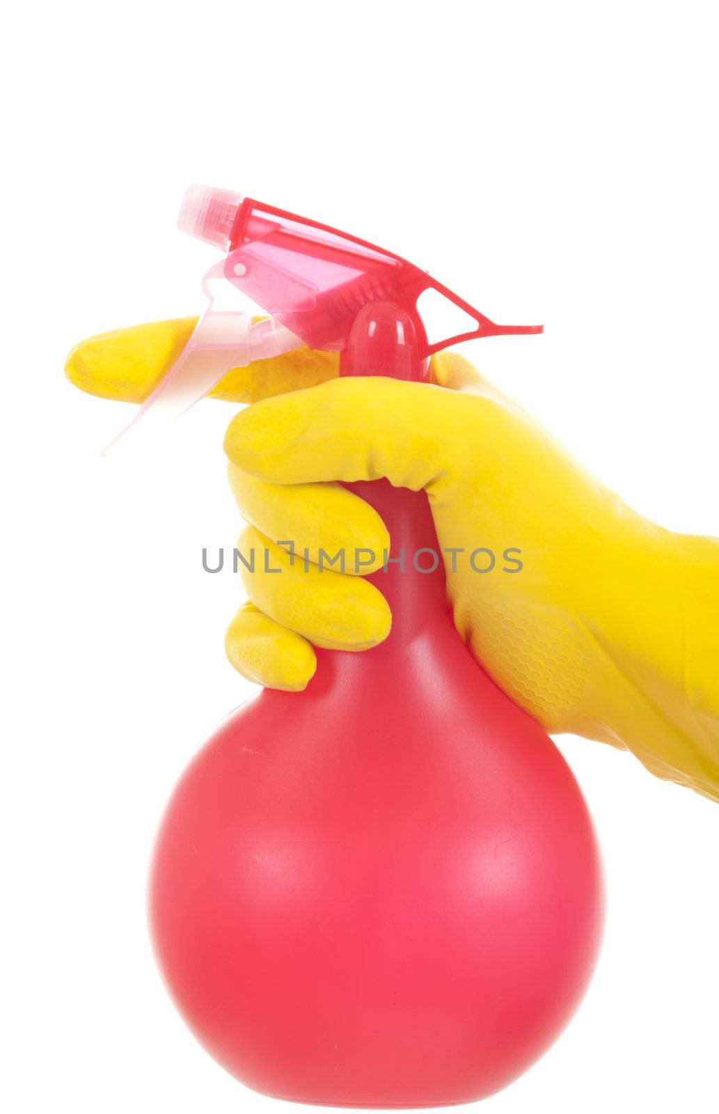 Hand in a yellow glove with red cleaning spray.