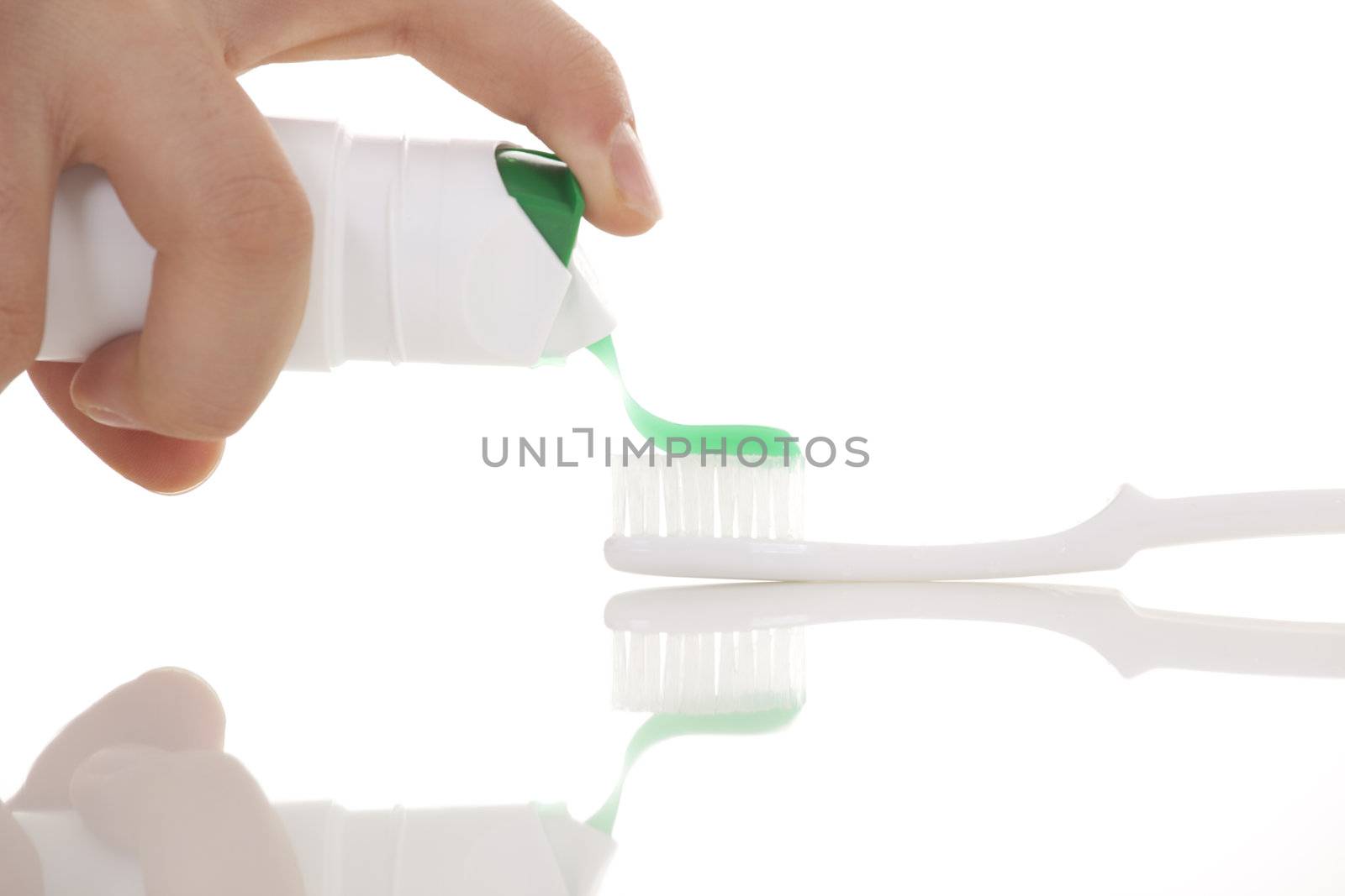 Tooth brush with tooth paste on white background