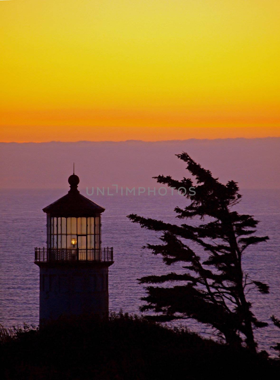 Light Shining in the North Head Lighthouse on the Washington Coast at Sunset