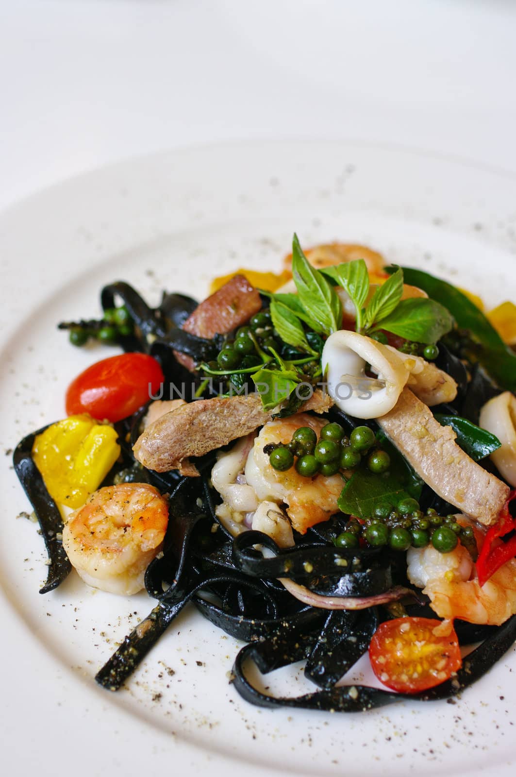 Pasta with fruit in white dish