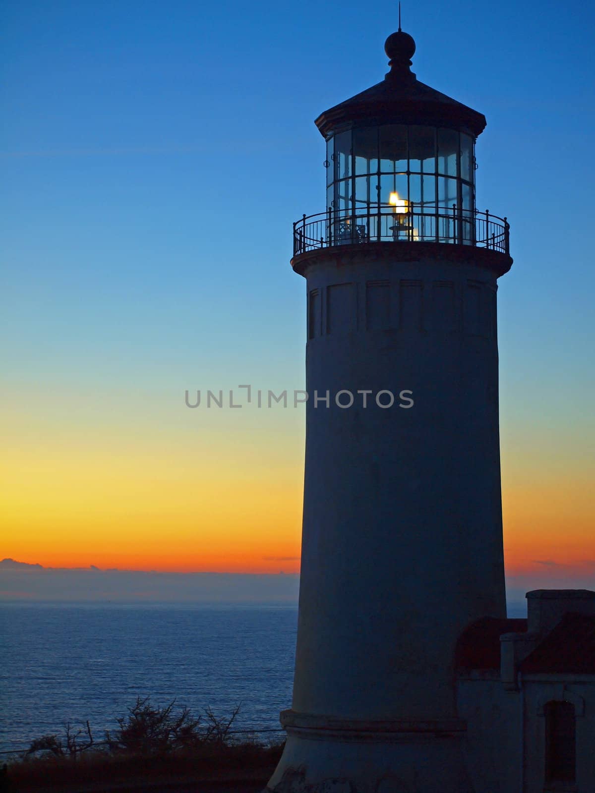 Light Shining in the North Head Lighthouse on the Washington Coast at Sunset