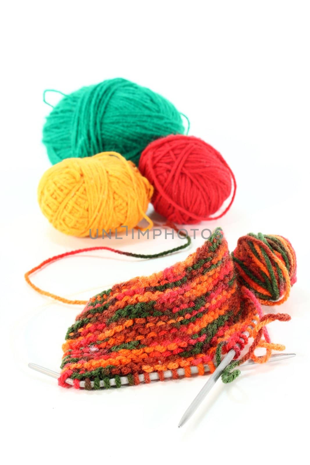 a colorful ball of yarn with a knitting sample