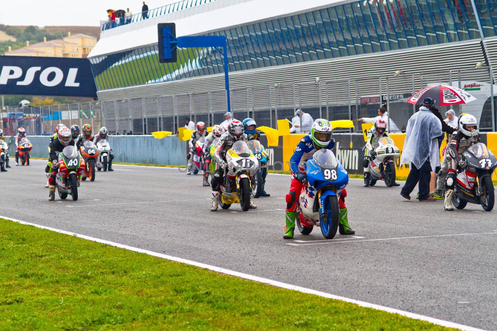 JEREZ DE LA FRONTERA, SPAIN - NOV 20: Motorbike competitors begin the 125GP - Moto3 race in the CEV Championship on November 20, 2011 in Jerez de la Frontera, Spain.