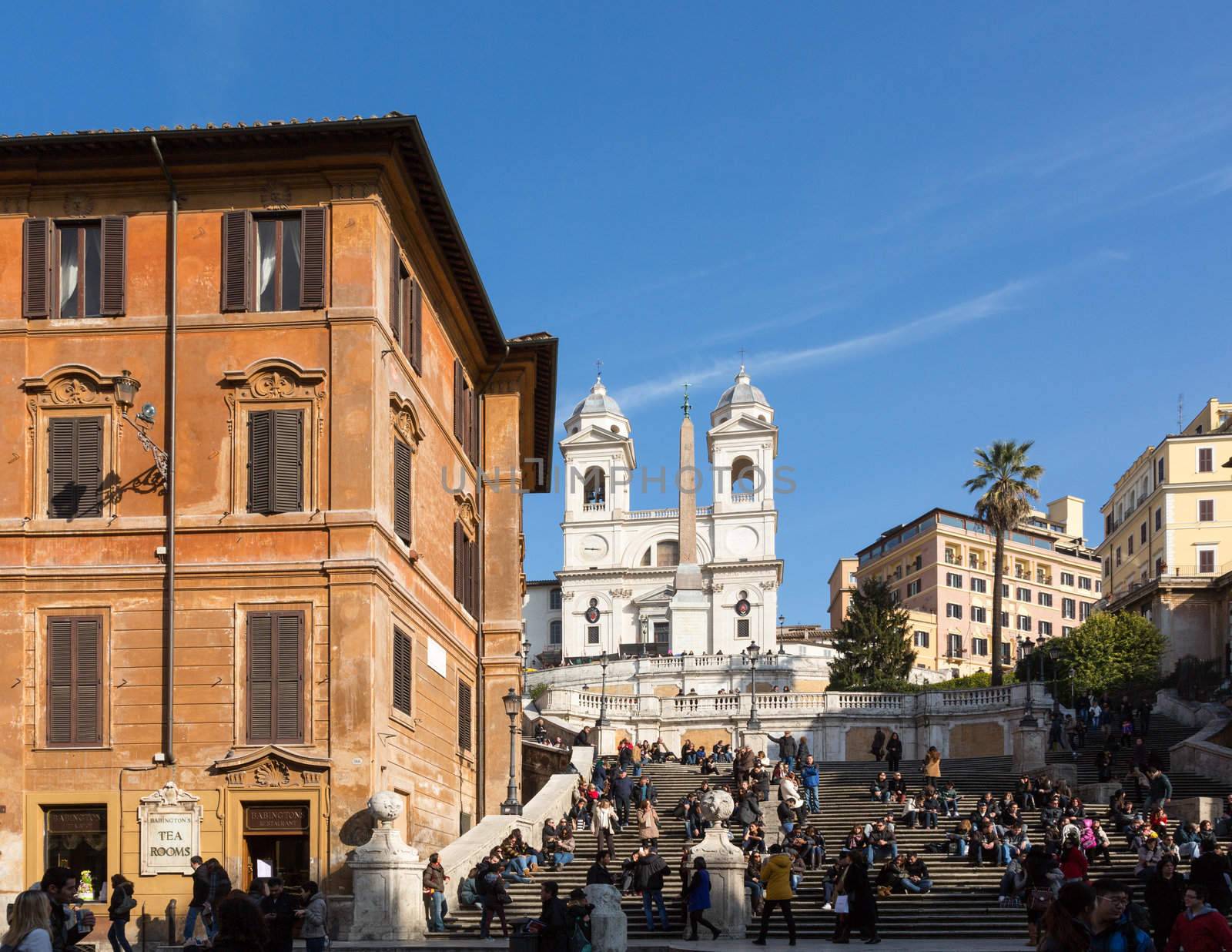 ROME, ITALY - JANUARY 27: Tourists sitting on Spanish Steps in Rome on January 27, 2013. The 138 steps were renovated in 1995