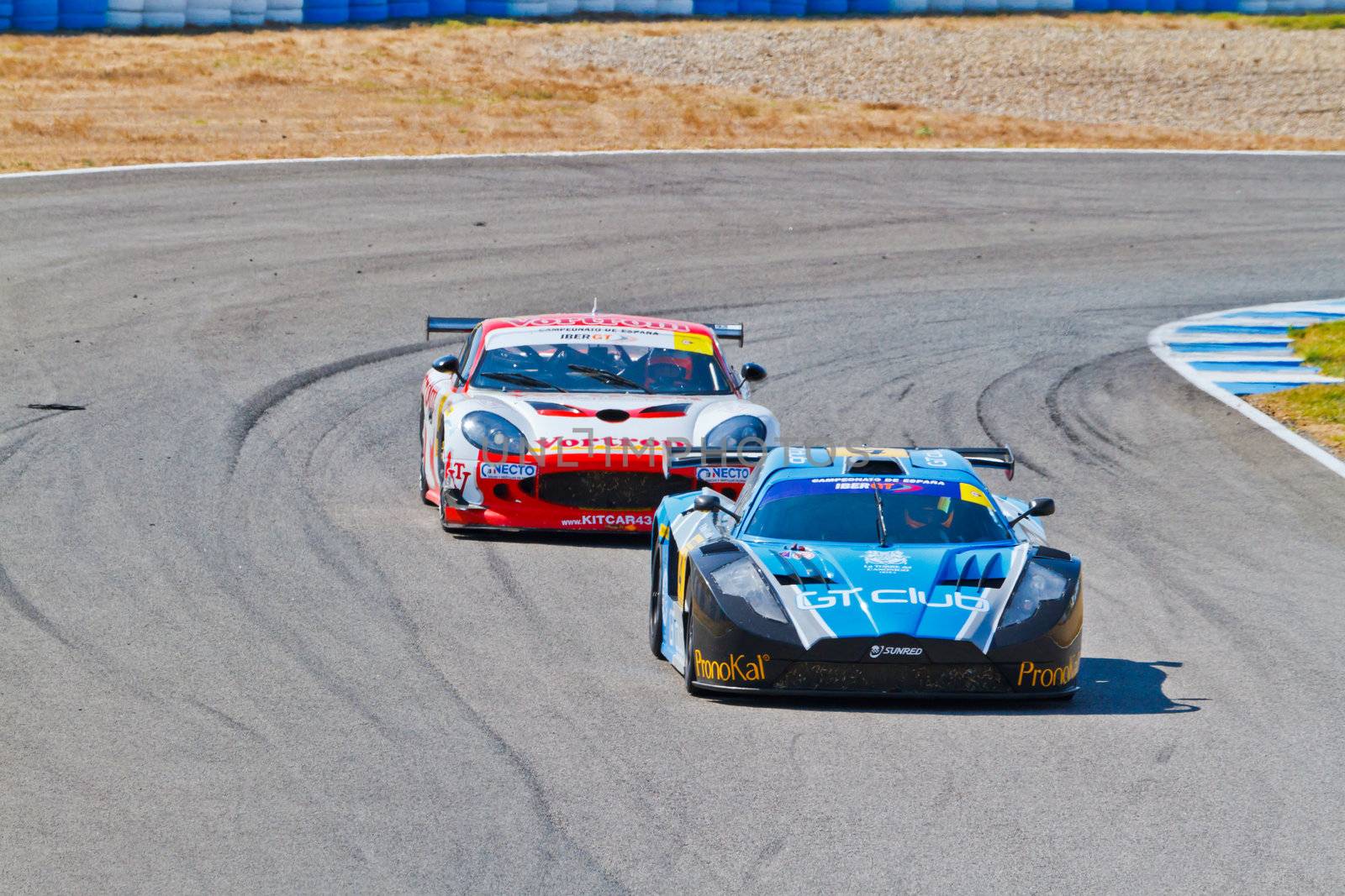 JEREZ DE LA FRONTERA, SPAIN - OCT 16: Ferran Monje(4) followed by Francesc Gutierrez(42)races on Iber GT championship on October 16 , 2011, in Jerez de la Frontera , Spain