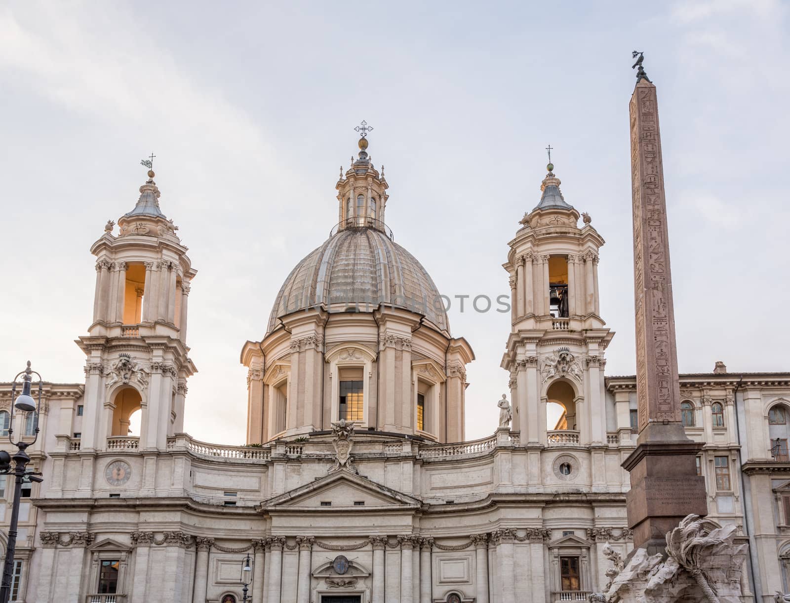 Sant Agnese in Agone lit up by setting sun in Piazza Navona