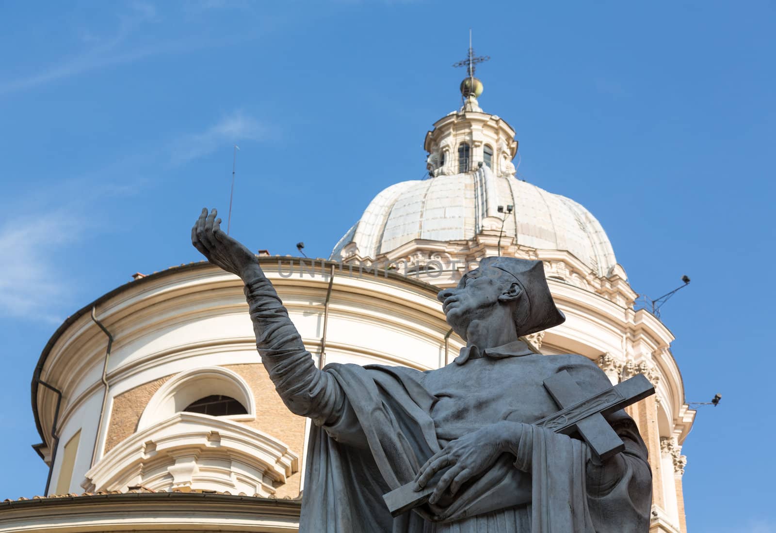 Detail of statue by dome on church of San Carlo al Corso in Rome Italy