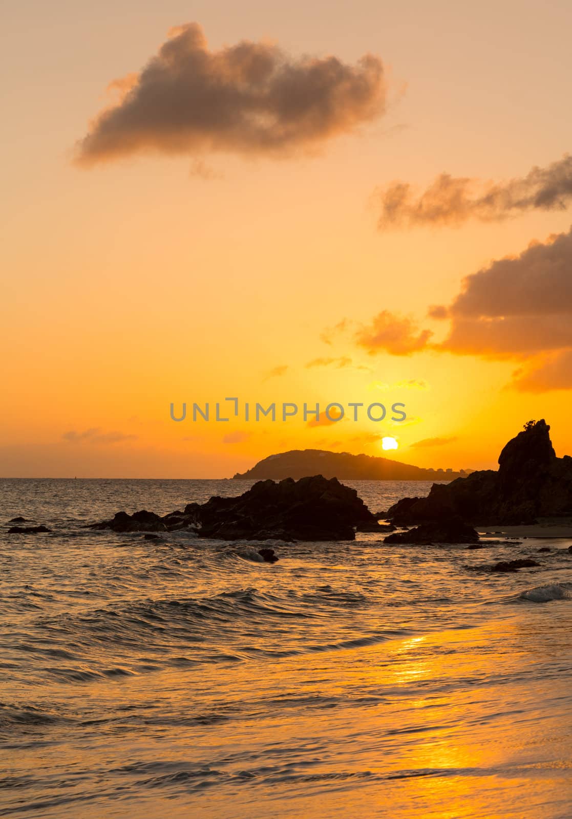 Sun setting over islands by Charlotte Amalie in St Thomas taken from Frenchmans Bay