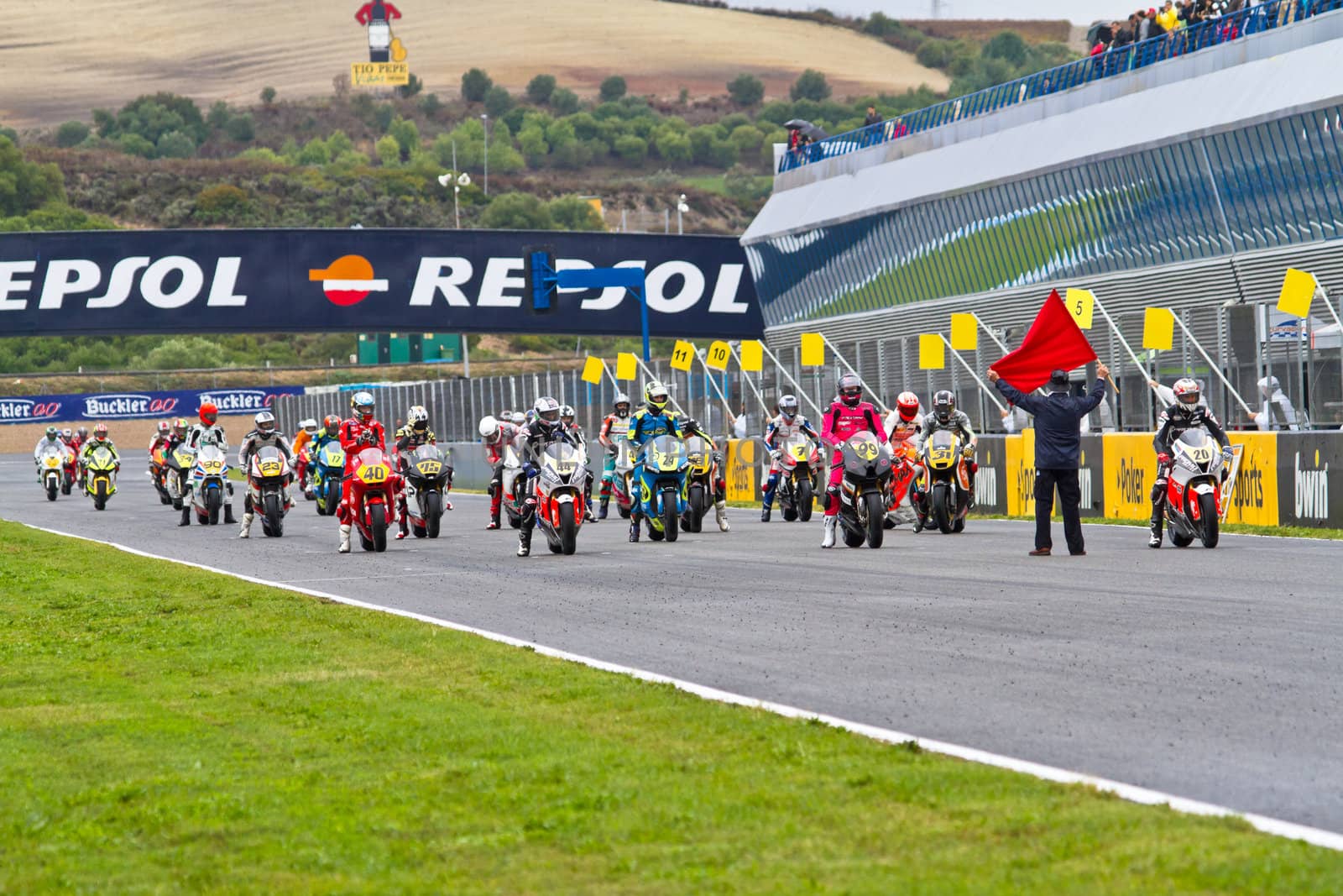 JEREZ DE LA FRONTERA, SPAIN - NOV 20: Motorbike competitors begin the Moto2 race in the CEV Championship on November 20, 2011 in Jerez de la Frontera, Spain.