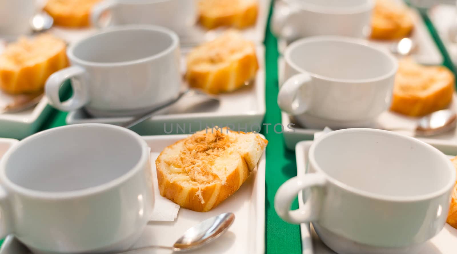 many fried Bread with dried shredded pork Thai dessert and white coffee cup