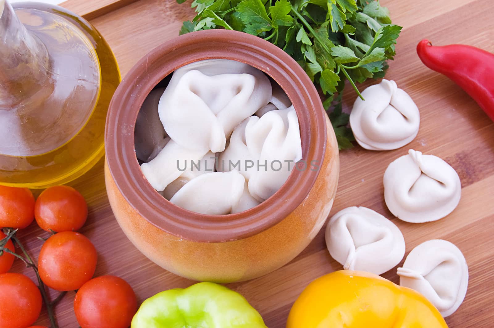 Meat dumplings in pot with ingredients