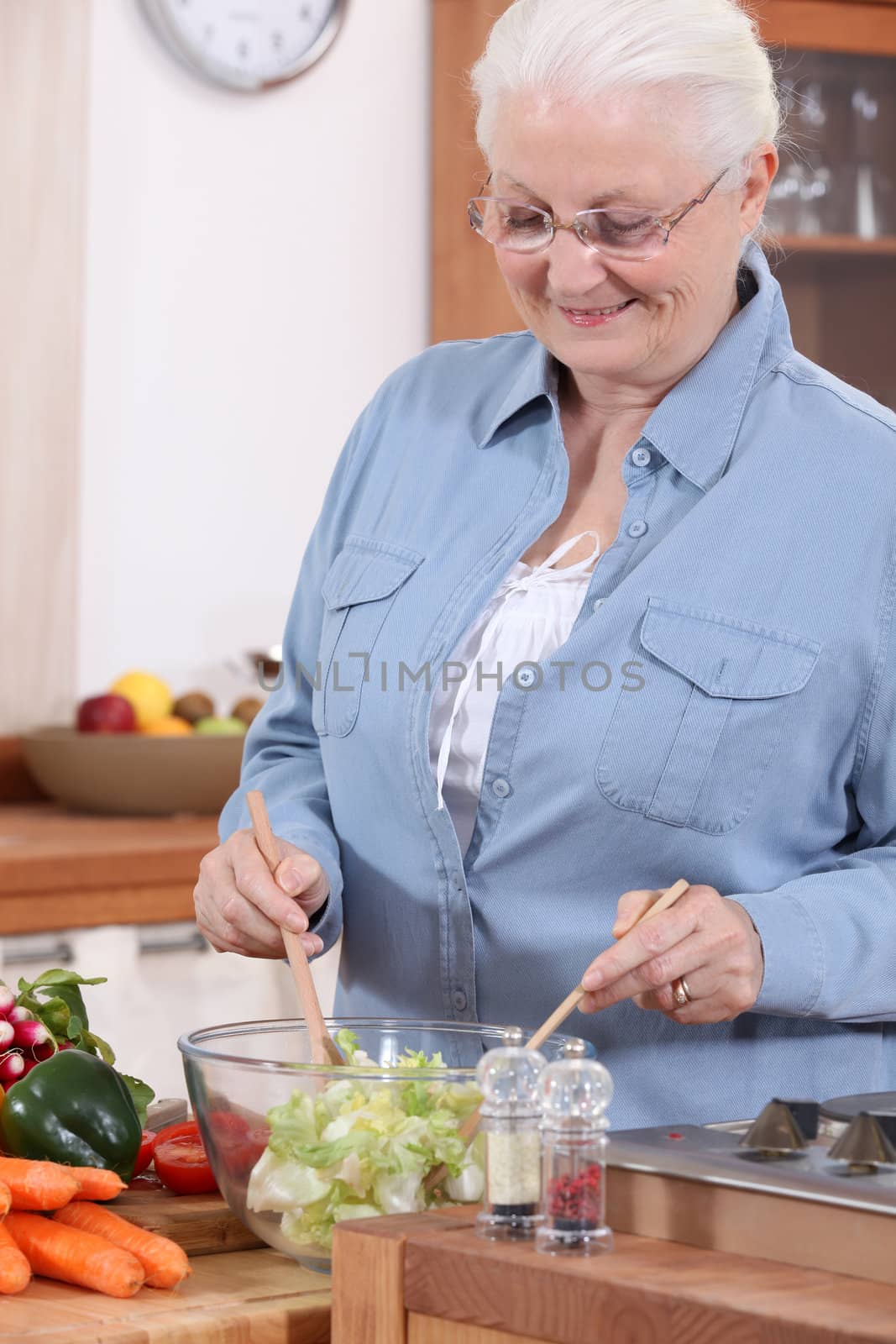 An old lady making a salad. by phovoir