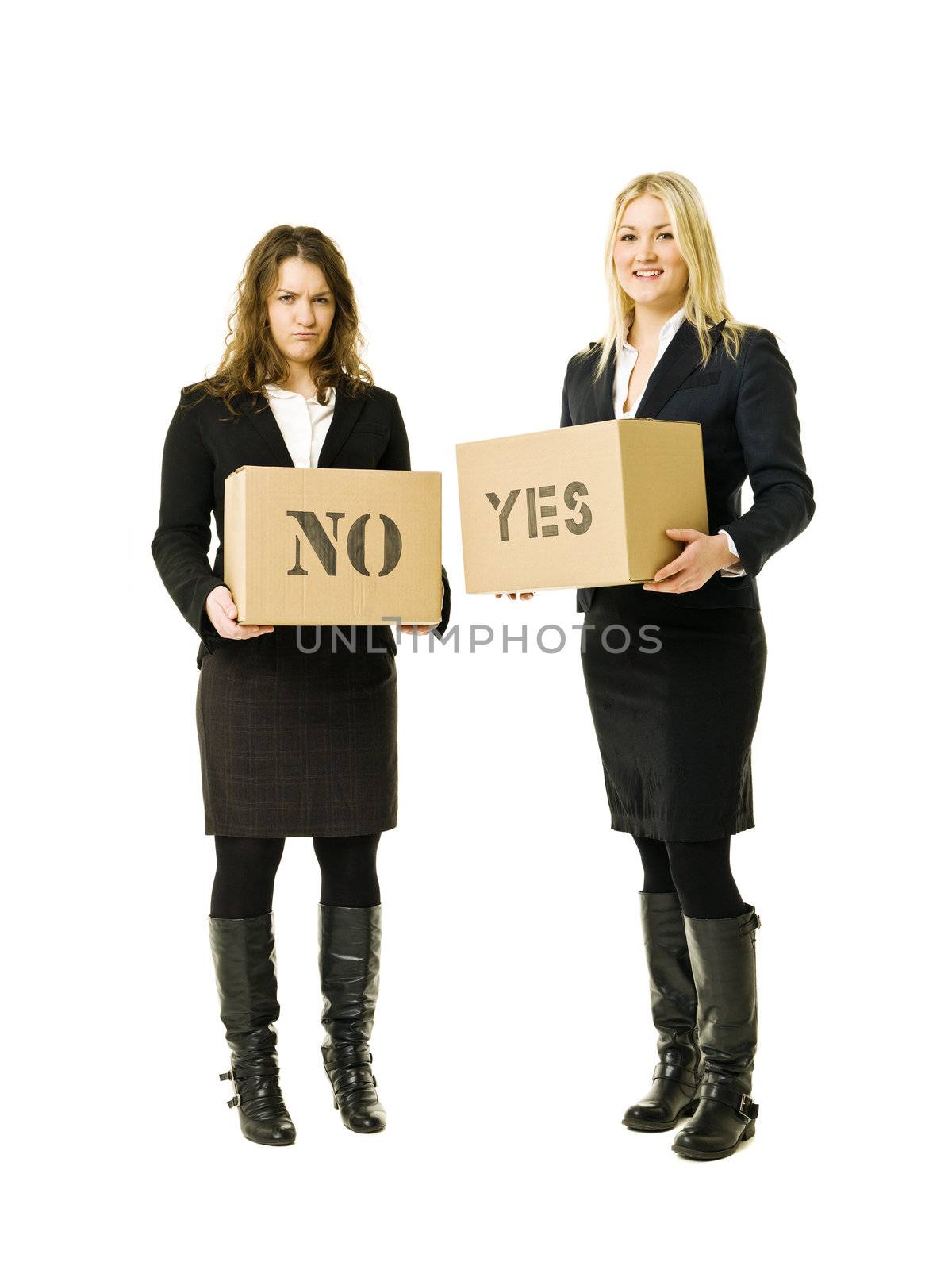 Businesswomen with yes- and no cardboard boxes isolated on white background
