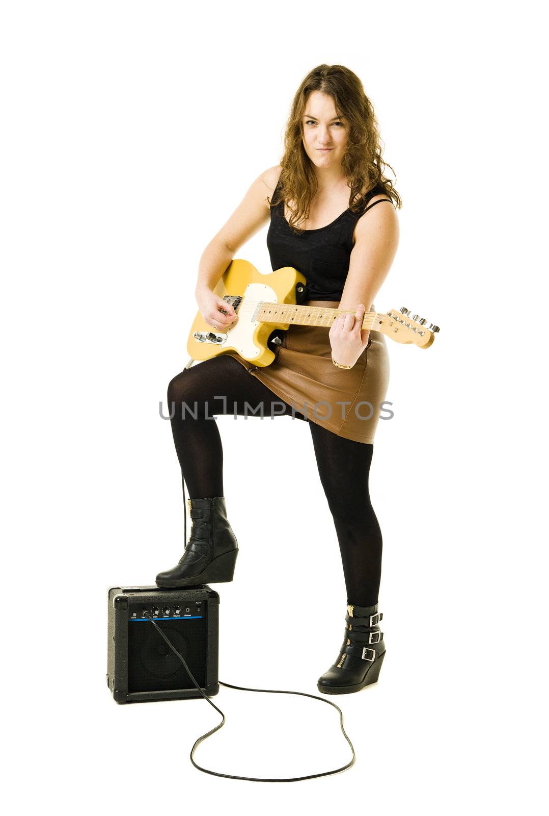 Young woman playing electric guitar isolated on white background