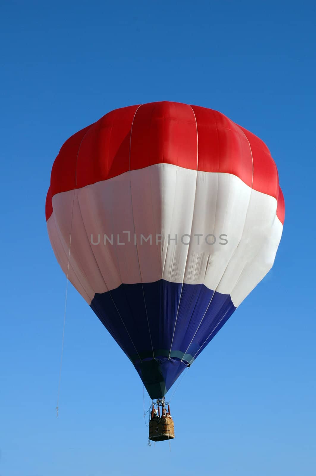 A balloon with white stripes, red and blue