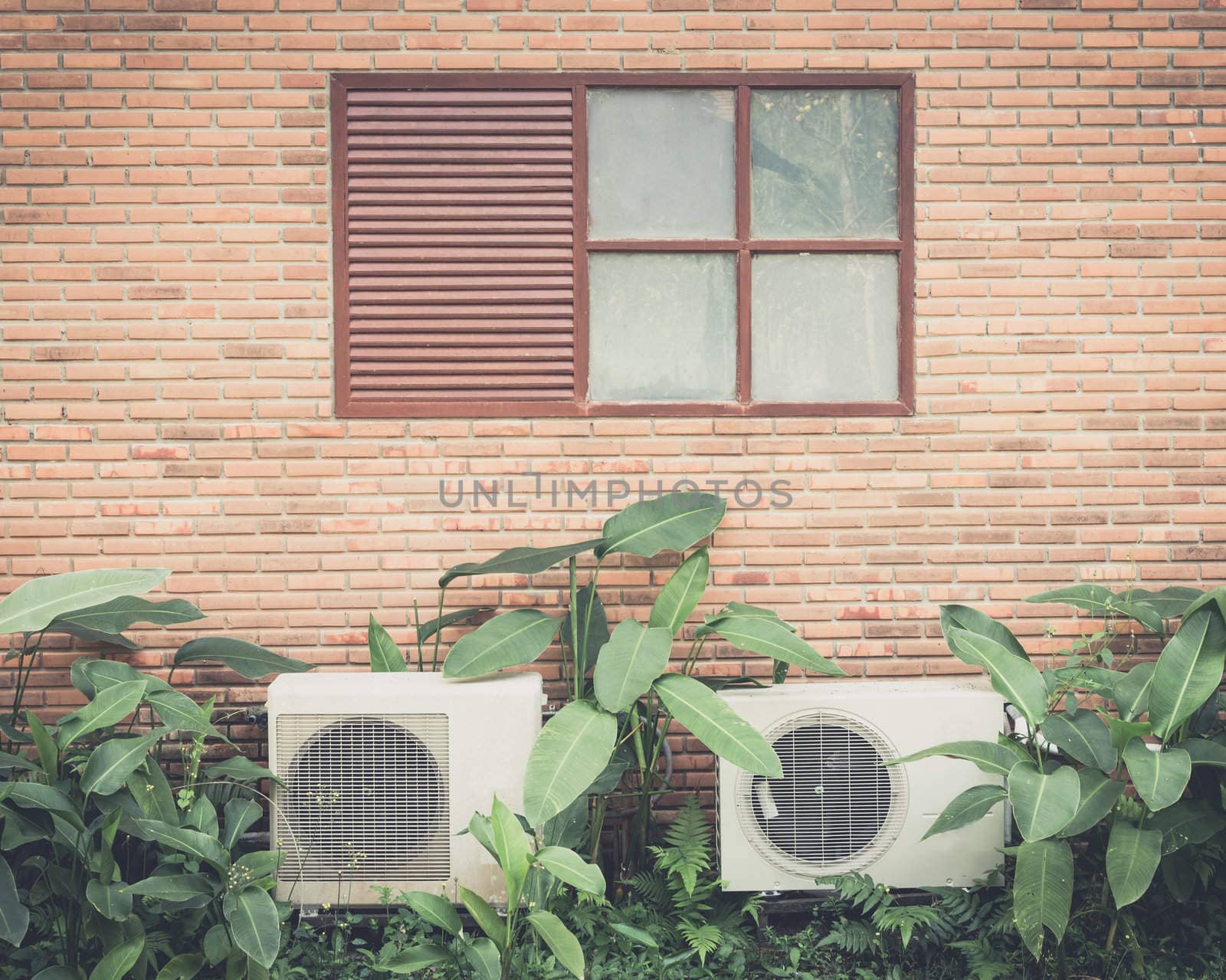 old windows on brick wall with Air conditioner process photo in retro style