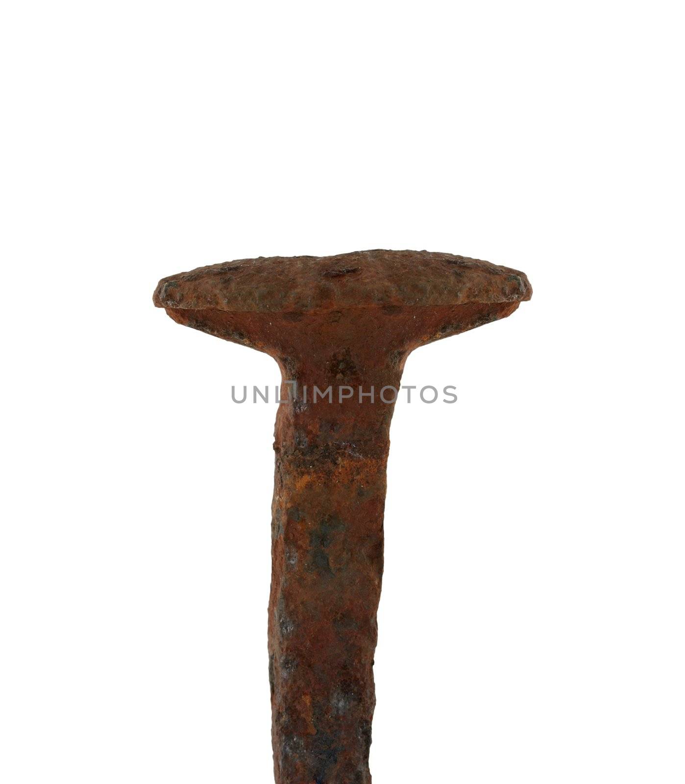 A Isolated rusty railroad spike on white
