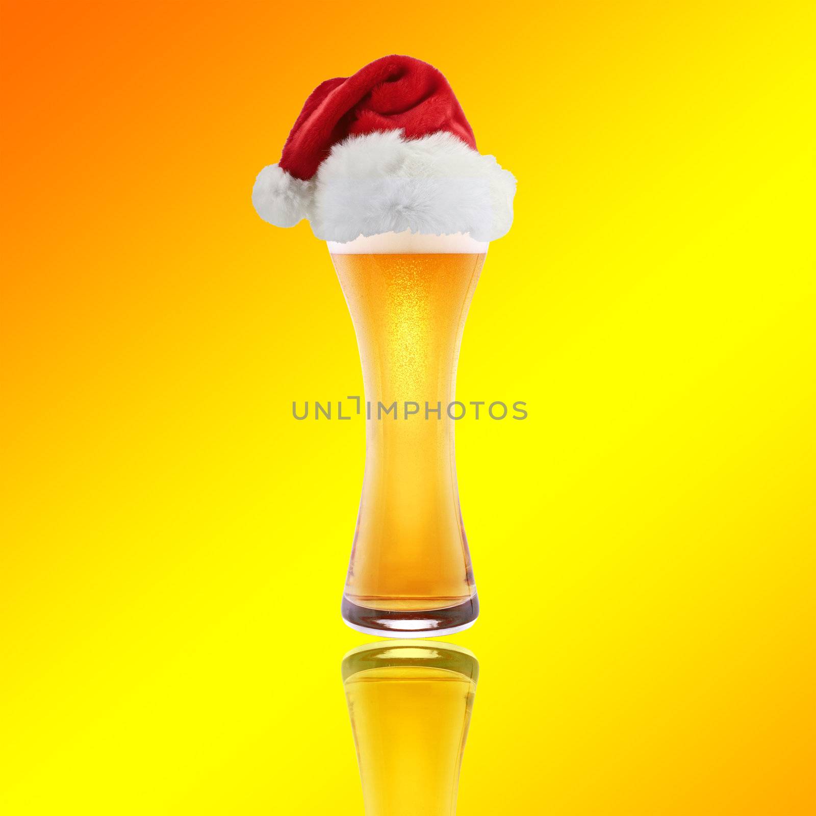 Santa Claus hat with beer on a yellow background by ozaiachin