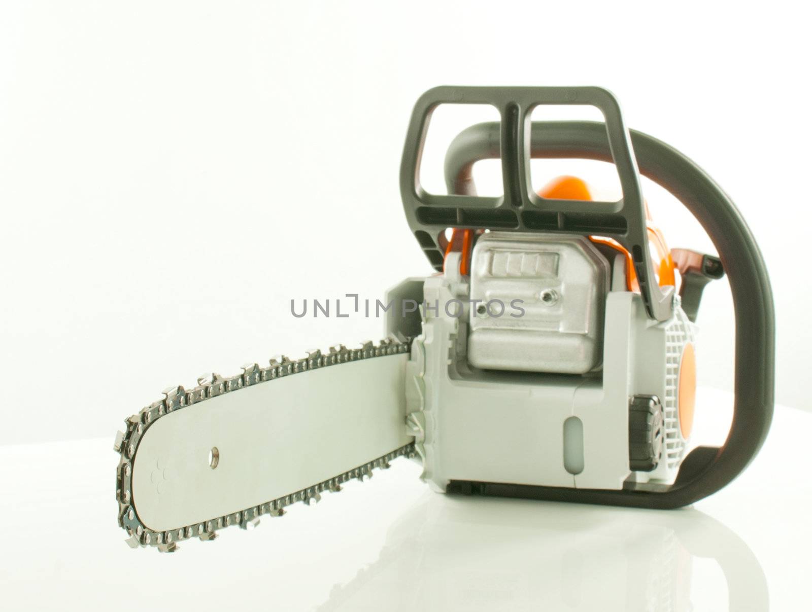 Chainsaw over the white background