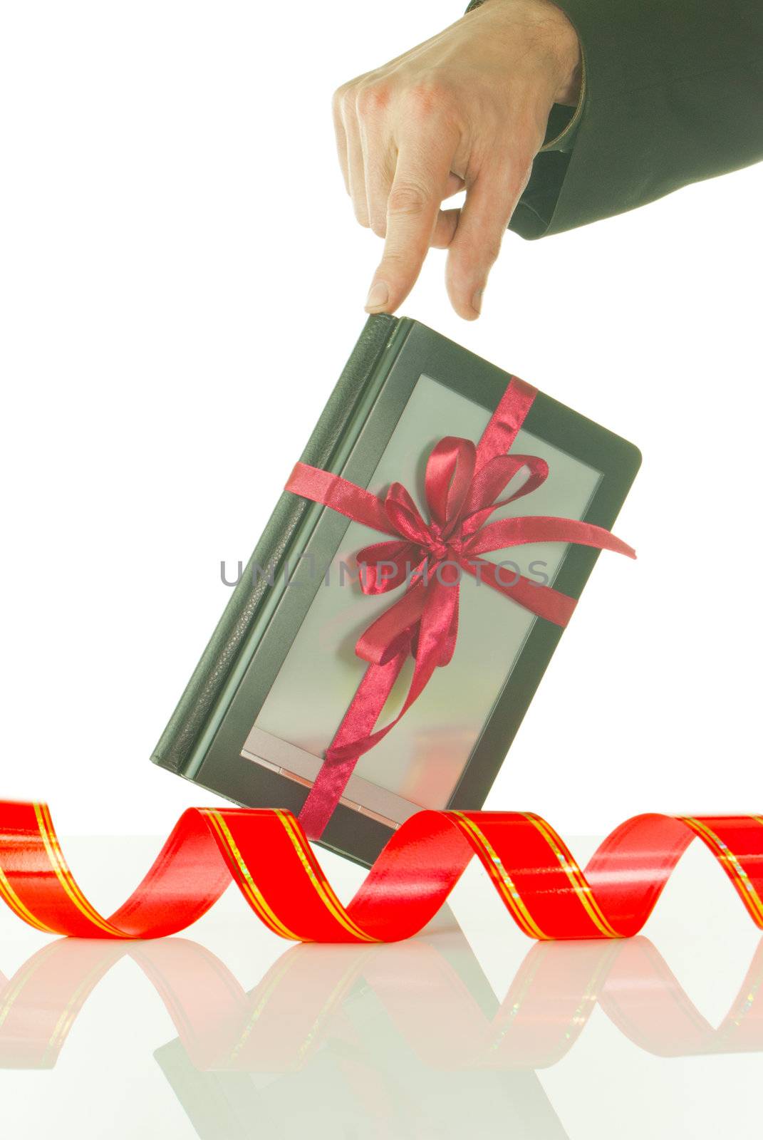 Man's hand holds electronic book reader against white background