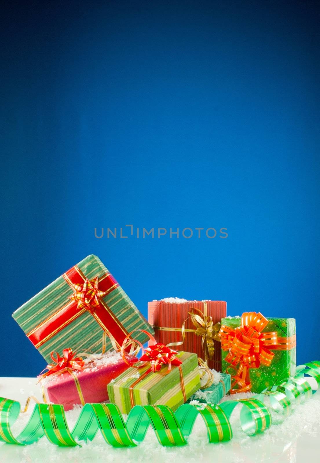 Christmas presents against blue background