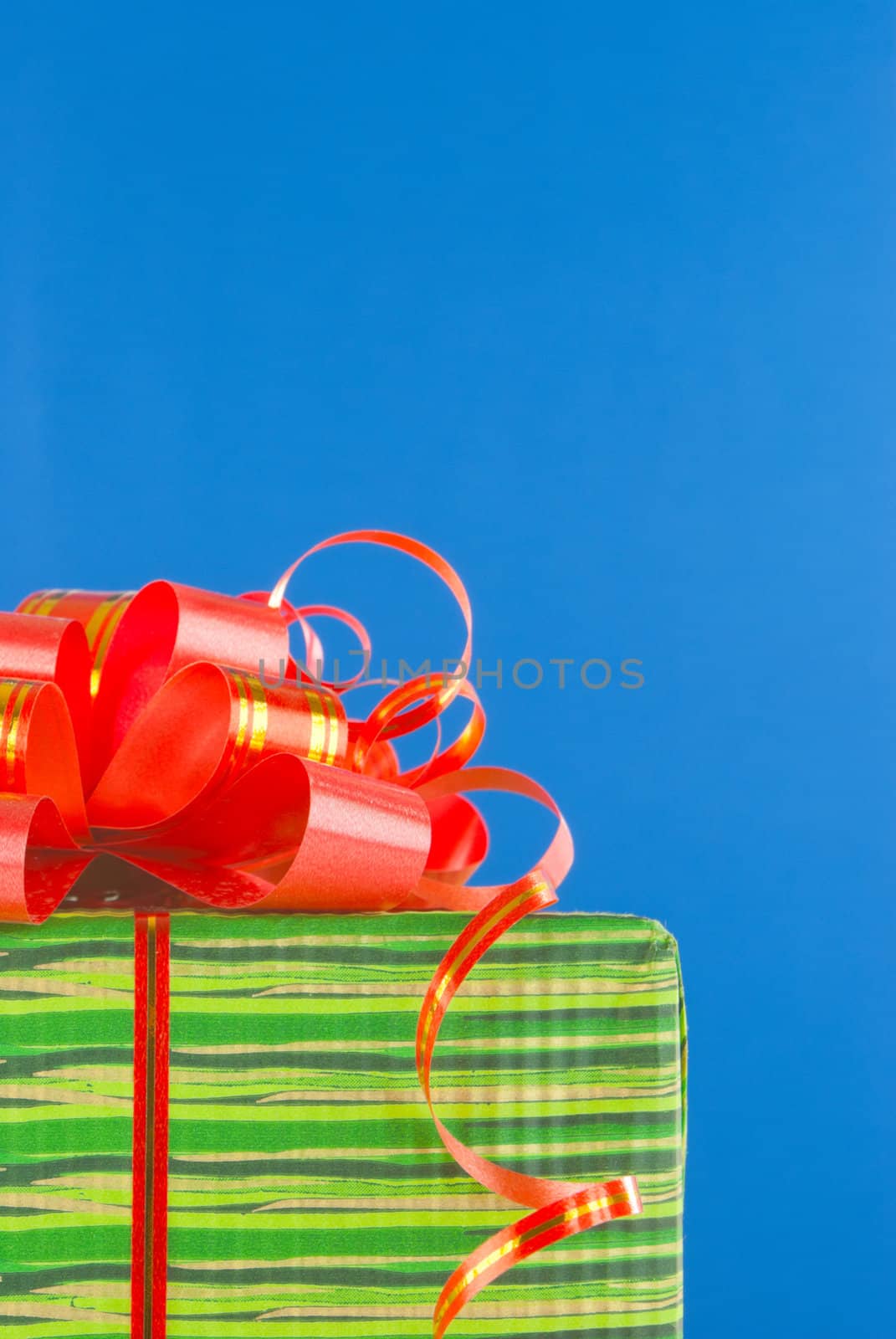 Green box with present against blue background