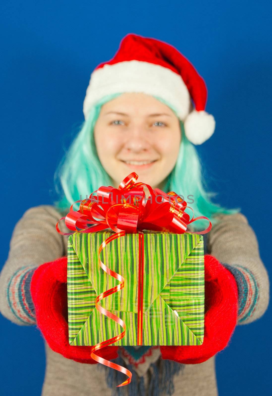 Teen girl holds a Christmas present by AndreyKr