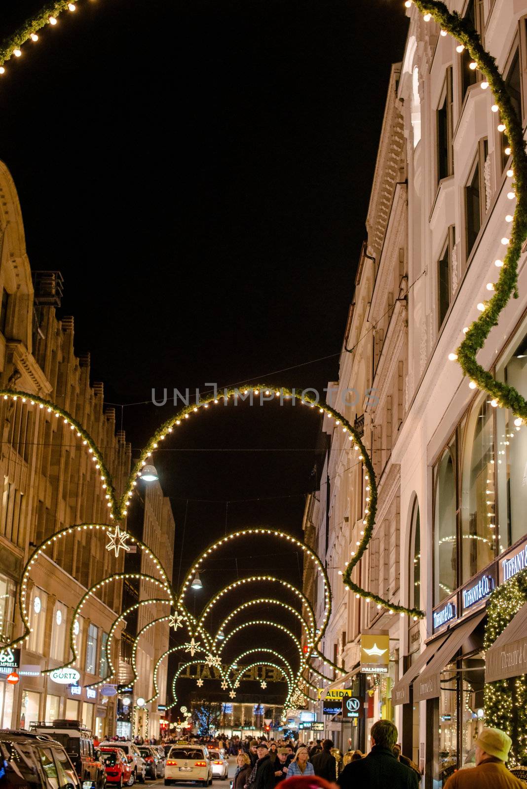 HAMBURG - DECEMBER 1 2012: People visit traditional Christmas decorated shopping area Neuer Wall in Hamburg, Germany on December 1, 2012. The street Neuer Wall was founded 1707 and is today housing exclusive shops – it is counted amongst the 10 most luxurious shopping streets in Europe.