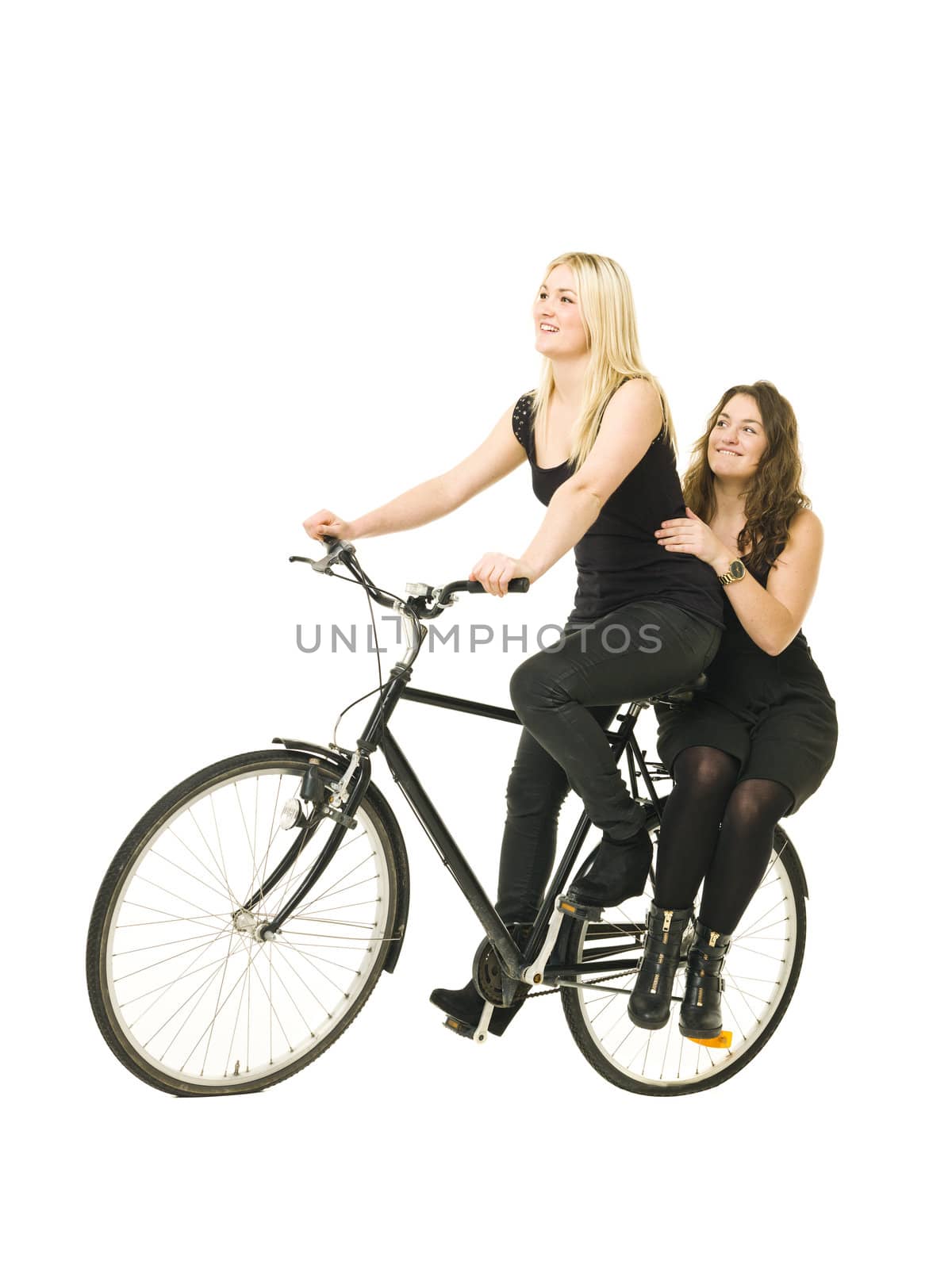 Two women on a bicycle isolated on white background