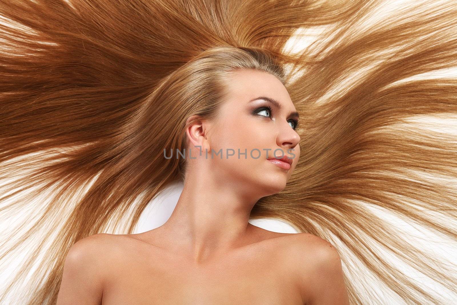 Caucasian woman with long beautiful blond hair isolated over white background