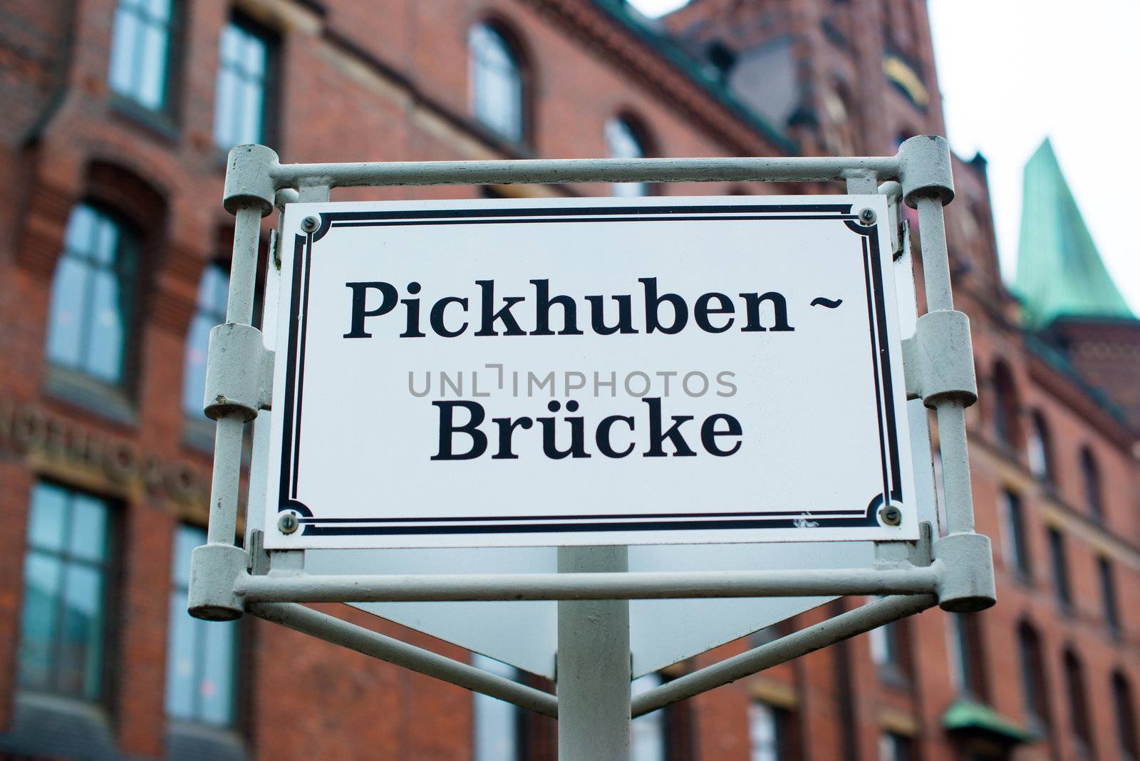 HAMBURG - DECEMBER 2, 2012: Beautiful warehouse at Pickhuben bridge in the traditional harbor area on December 2, 2012 in Hamburg Germany. The buildings in Hamburg harbor were built starting 1883 and are responsible for the traditional appearance of the area that is now converted into a modern office and resident area.