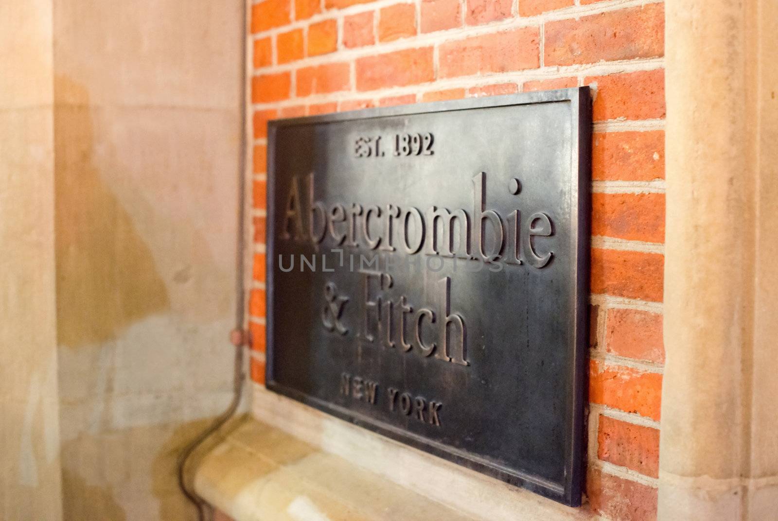 HAMBURG - DECEMBER 1, 2012: Plaque at the entrance of the newly opened Abercrombie & Fitch flagship store on December 1, 2012 in Hamburg Germany. Abercrombie & Fitch was founded 1892 in New Albany in the US and currently runs more than 1.000 stores worldwide including their second brand Hollister.