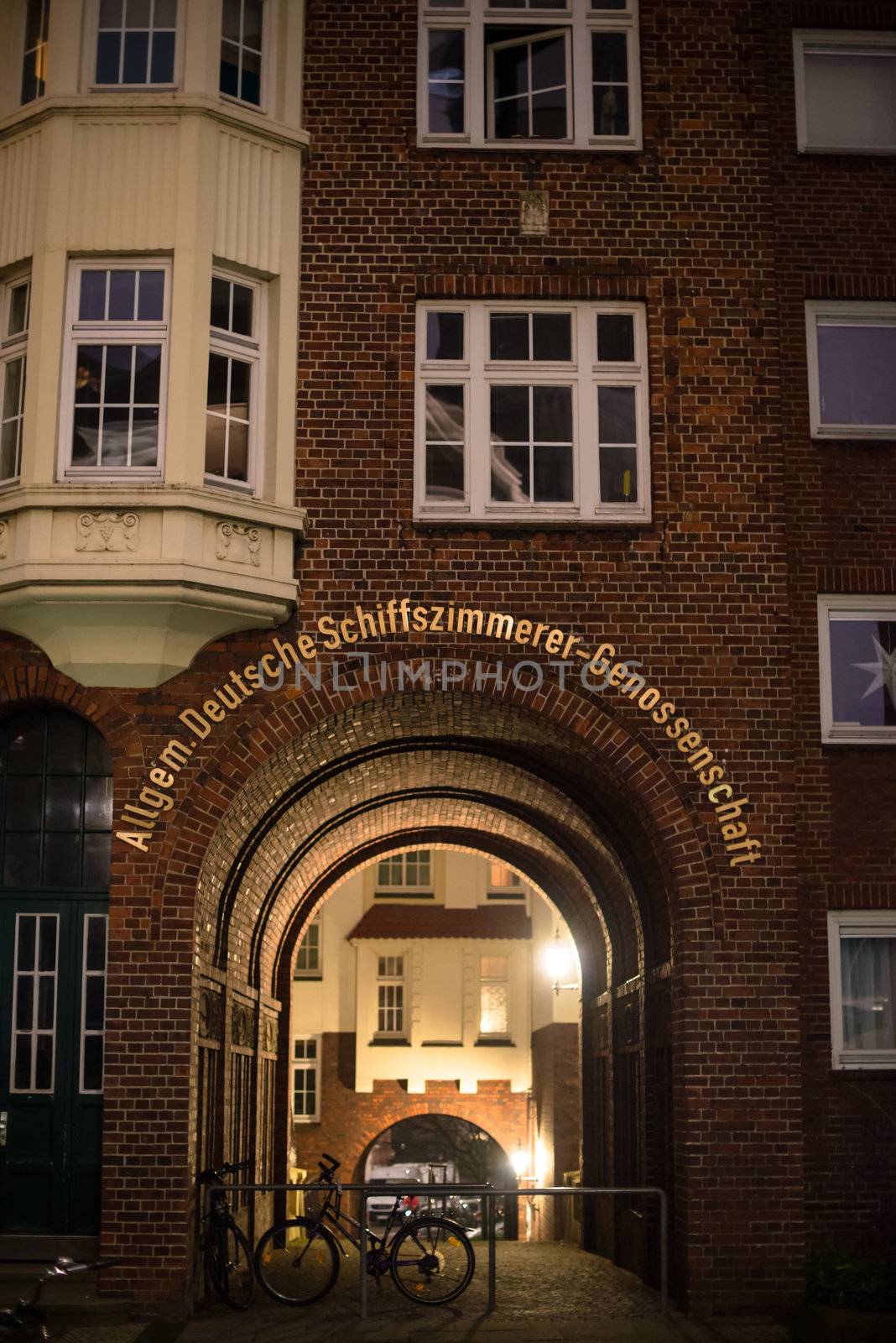 HAMBURG - DECEMBER 1, 2012: Beautiful old brick house of the German ship carpenters union near St. Michel church on the evening of December 1, 2012 in Hamburg Germany. The ship carpenters were traditionally an important workforce during the high times of ship trading in the past of Hamburg harbor.