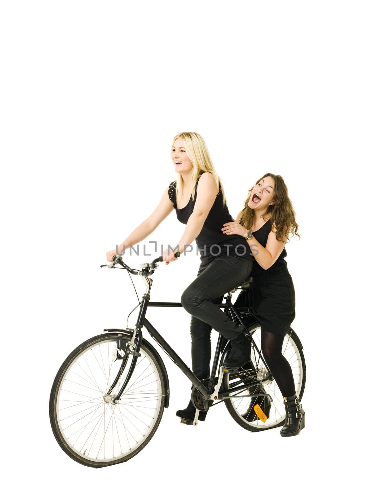 Two women on a bicycle isolated on white background