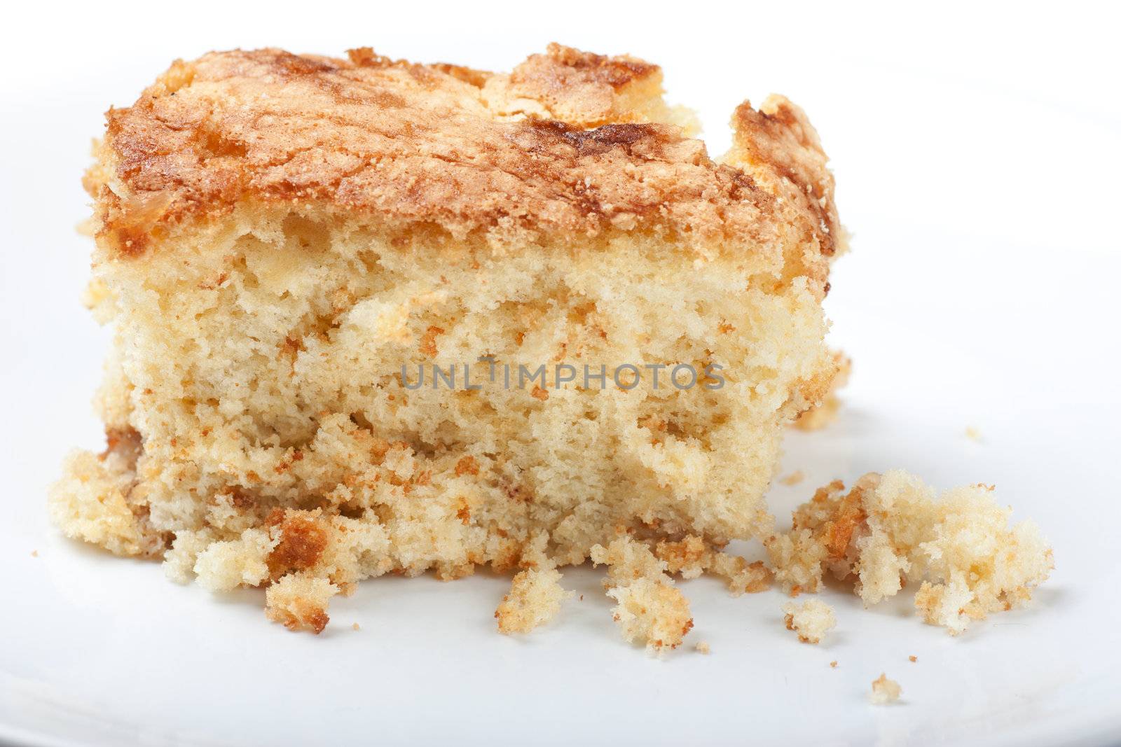 A piece of apple pie on a white plate