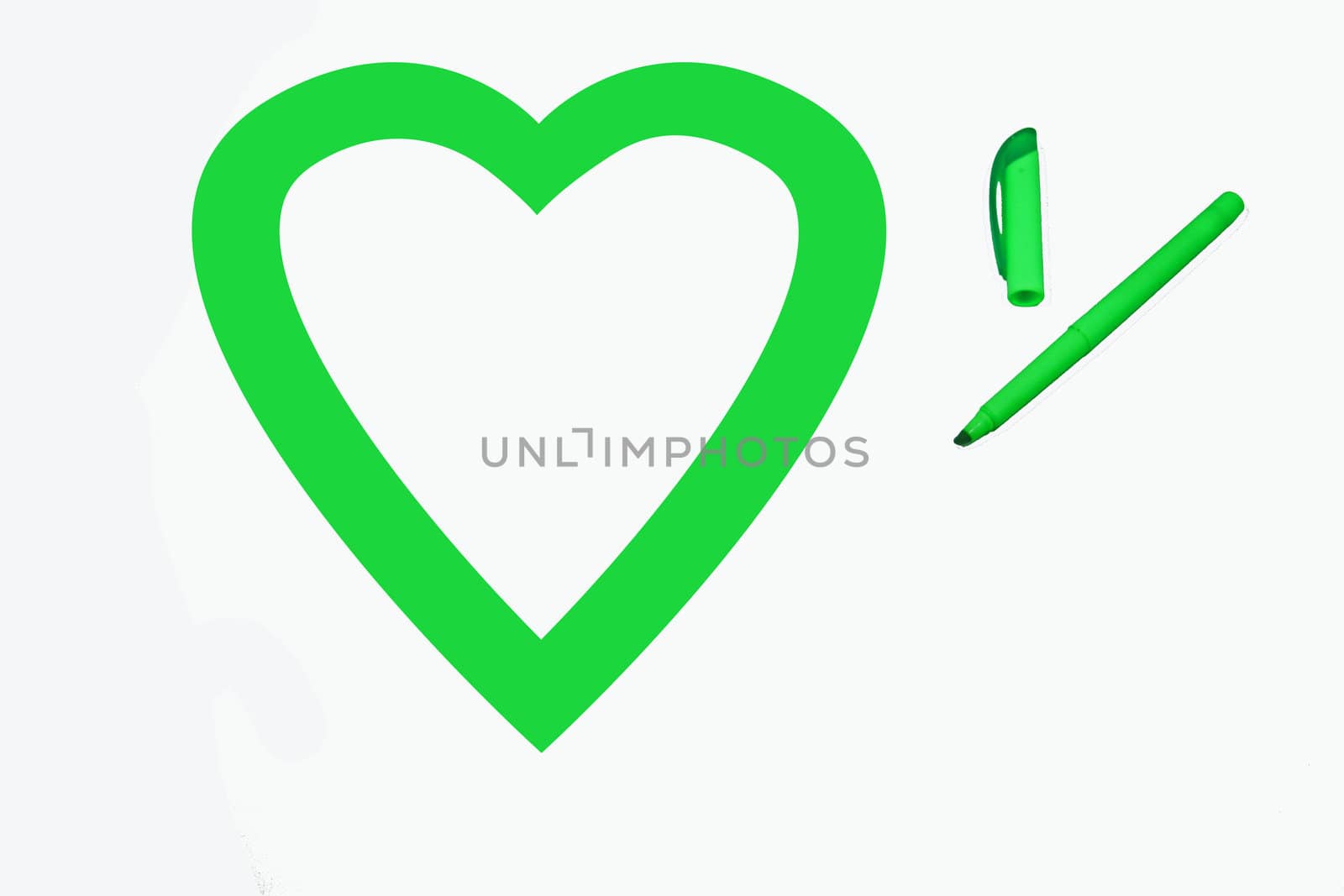Heart shape colored green by office highlighter on white background