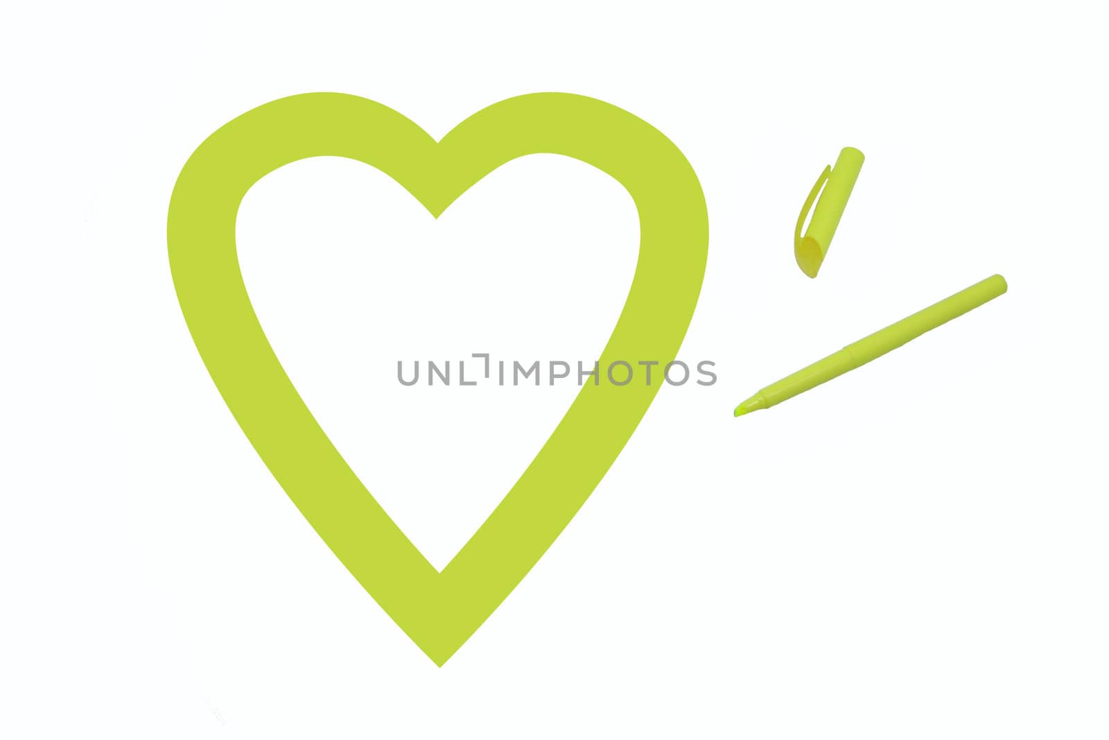 Heart shape colored yellow by office highlighter on white background