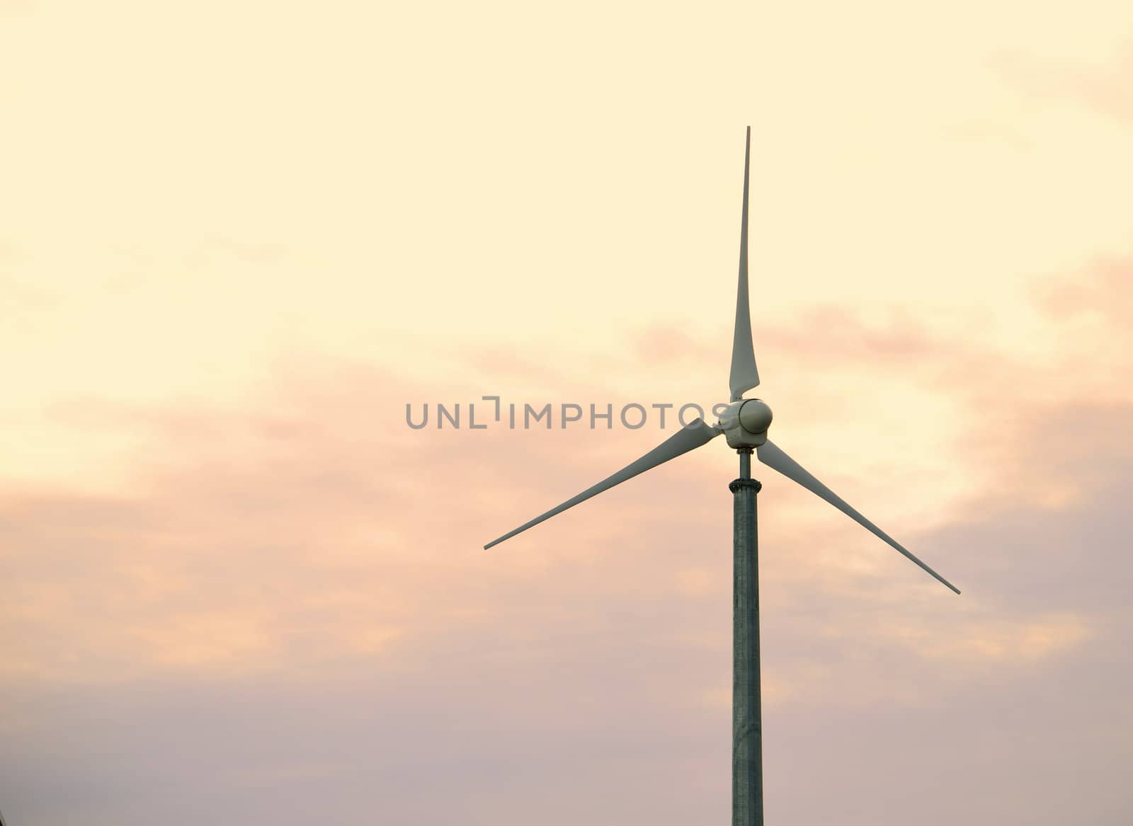 Wind turbine at dusk by artofphoto