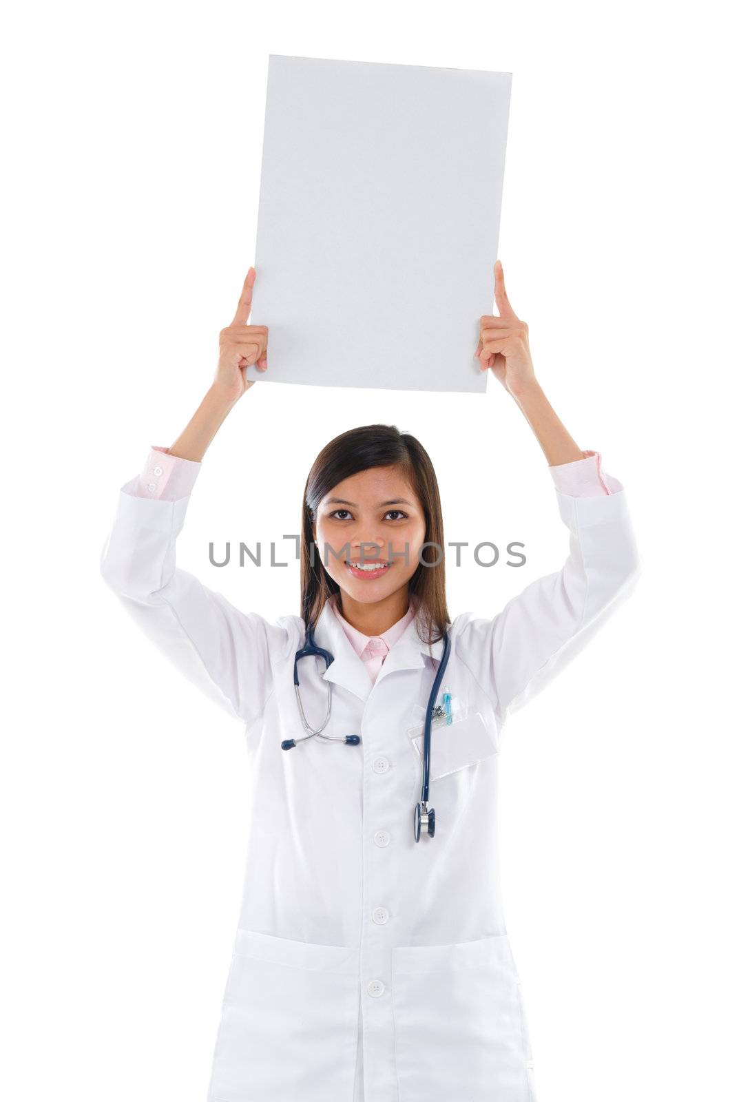 Southeast Asian female medical doctor showing white blank card on top of head, isolated on white background.