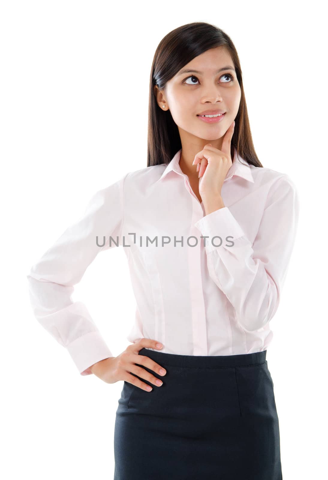 Attractive Southeast Asian corporate secretary standing and having a thought,  isolated on white background