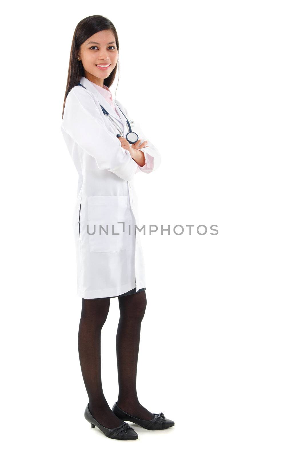 Full body Southeast Asian female medical doctor standing isolated on white background.