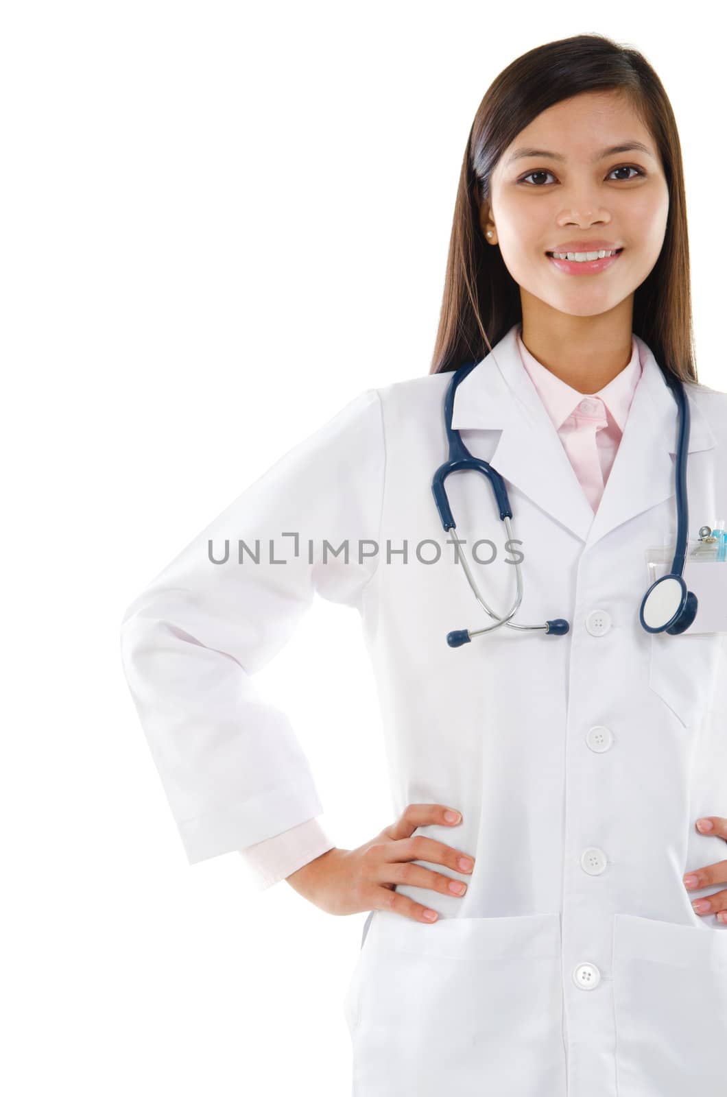 Attractive Southeast Asian female medical doctor standing isolated on white background.