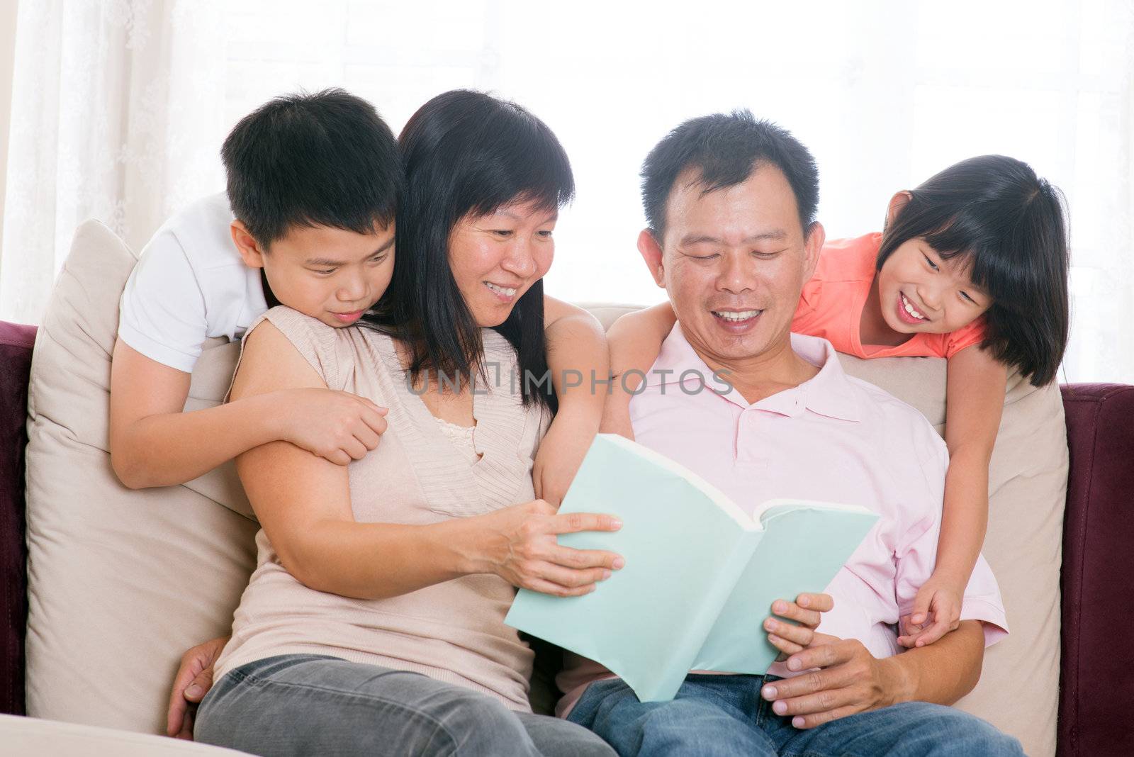 Parents and children reading books at home. by szefei