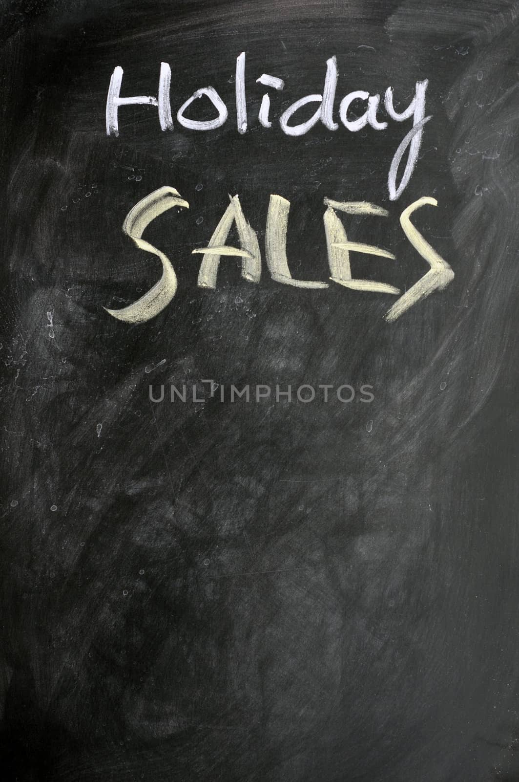 Holiday sales written with chalk on a blackboard