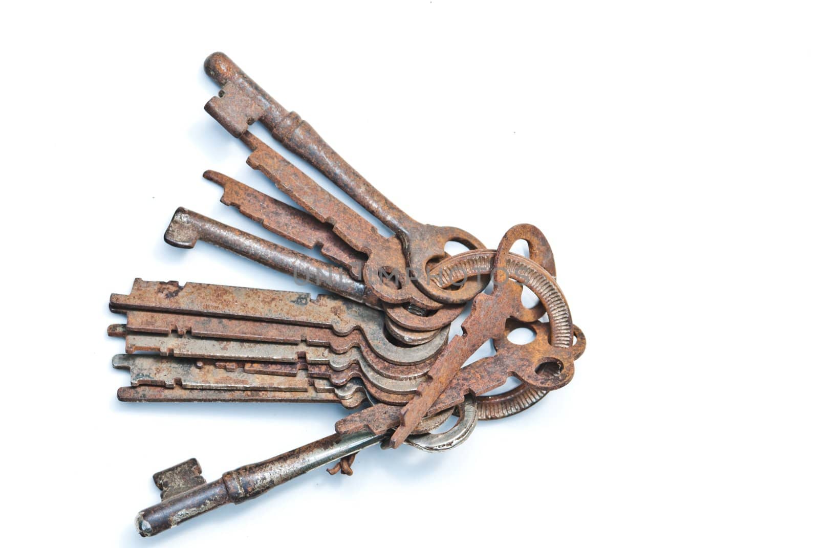 Old keys in isolated white background
 by sasilsolutions