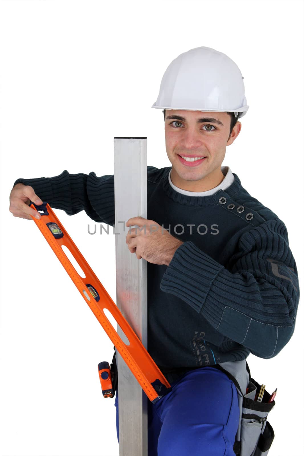 Worker with level spirit on white background by phovoir