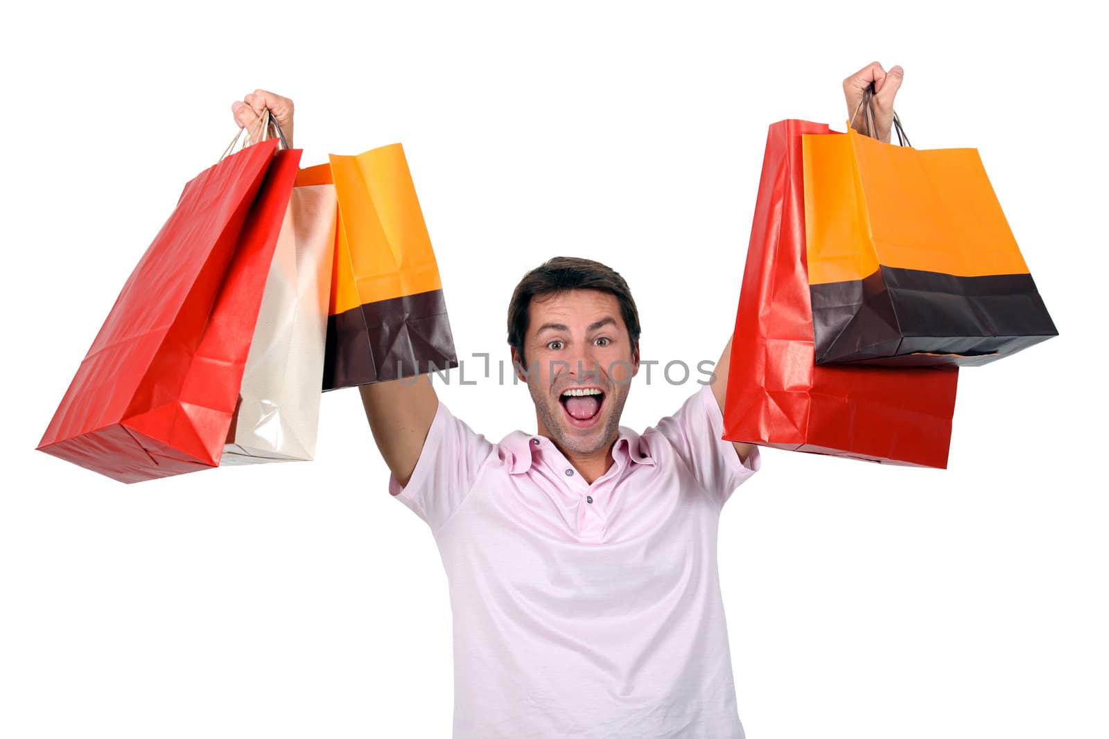 Man holding up shopping bags by phovoir